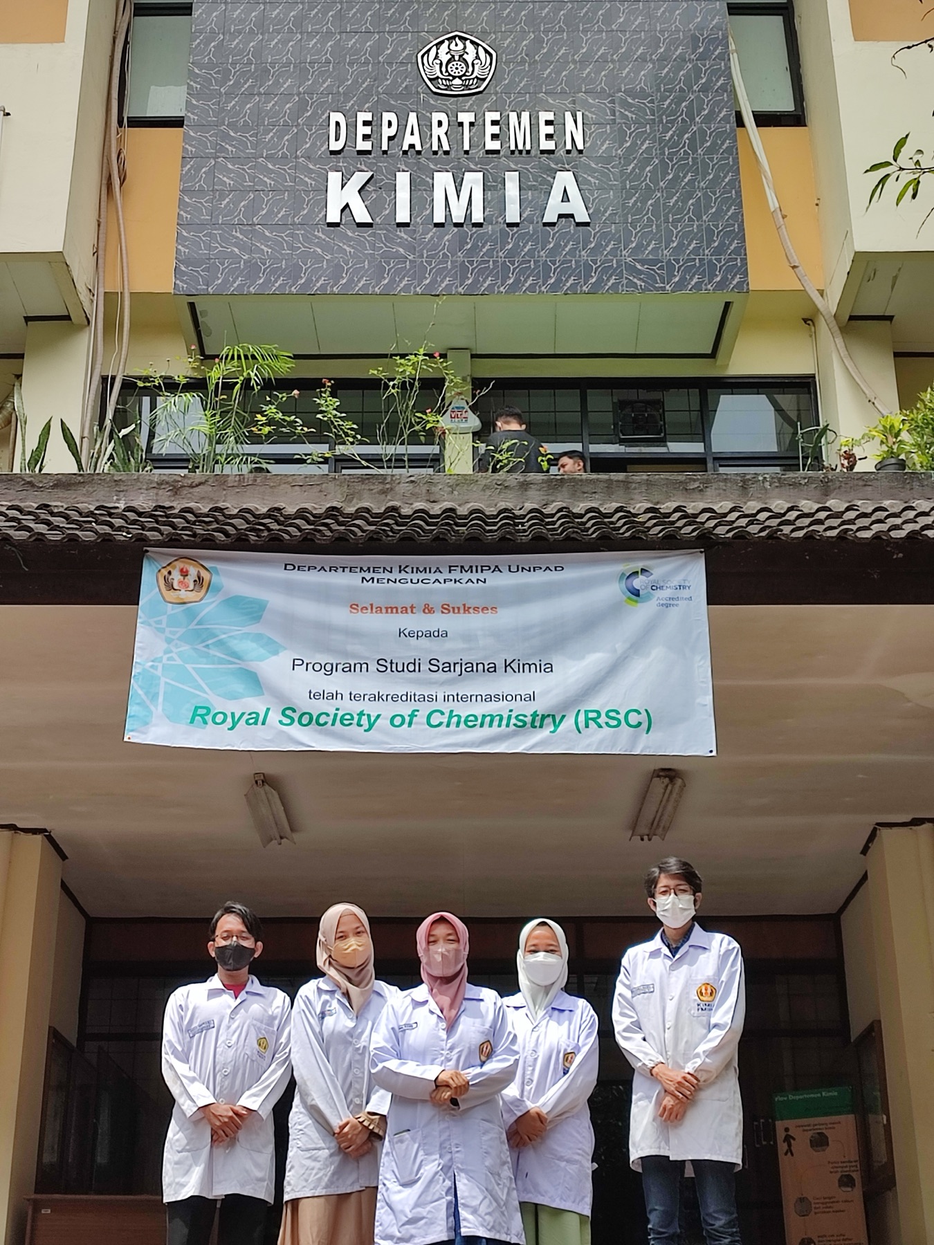 A second group portrait outside the Chemistry Department